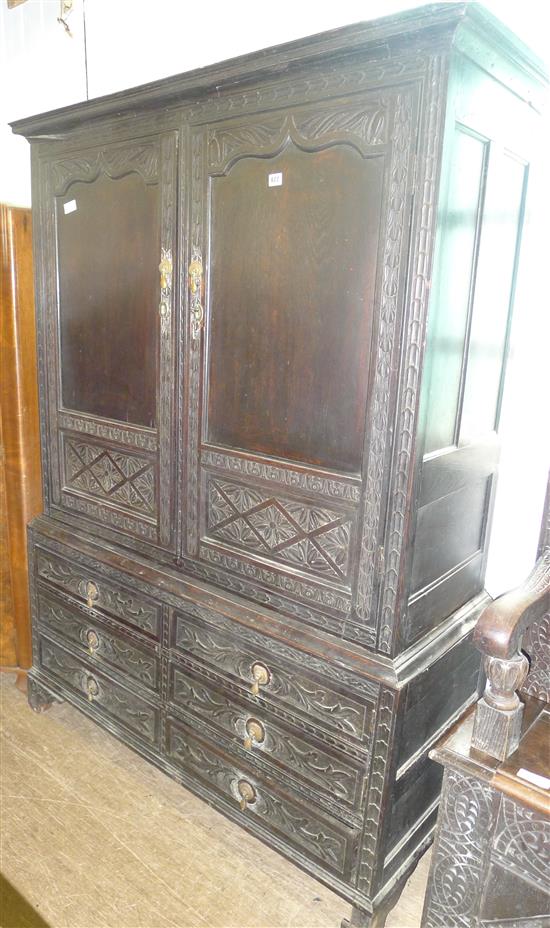 Carved oak linen press